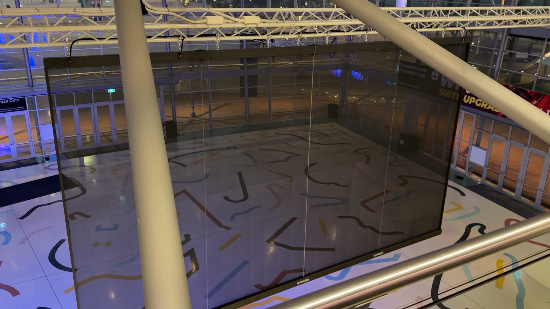 Transparent LED screen at Afterpay Arena, seeing straight through to the floor below