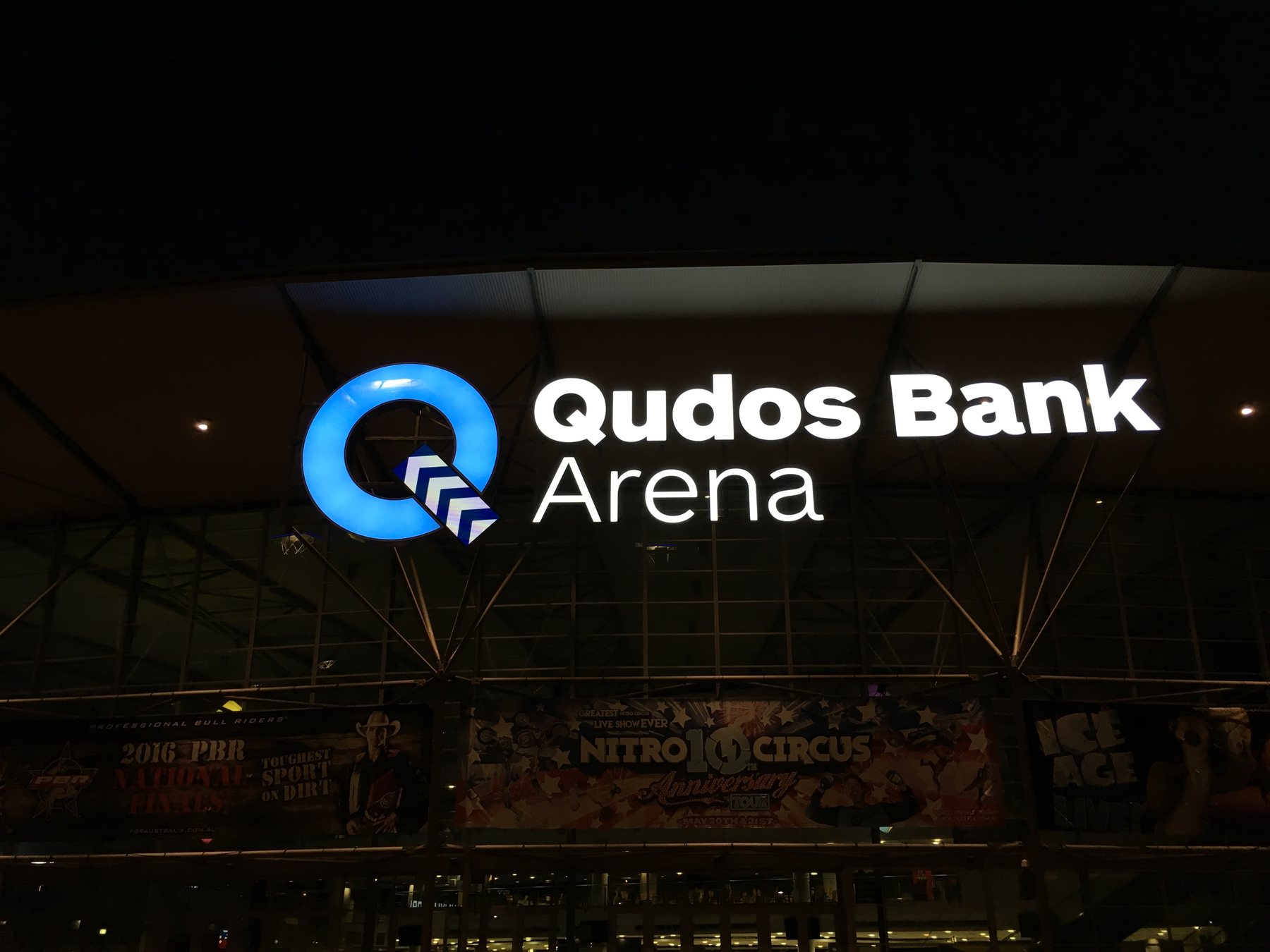 Qudos Bank Arena illuminated logo, blue