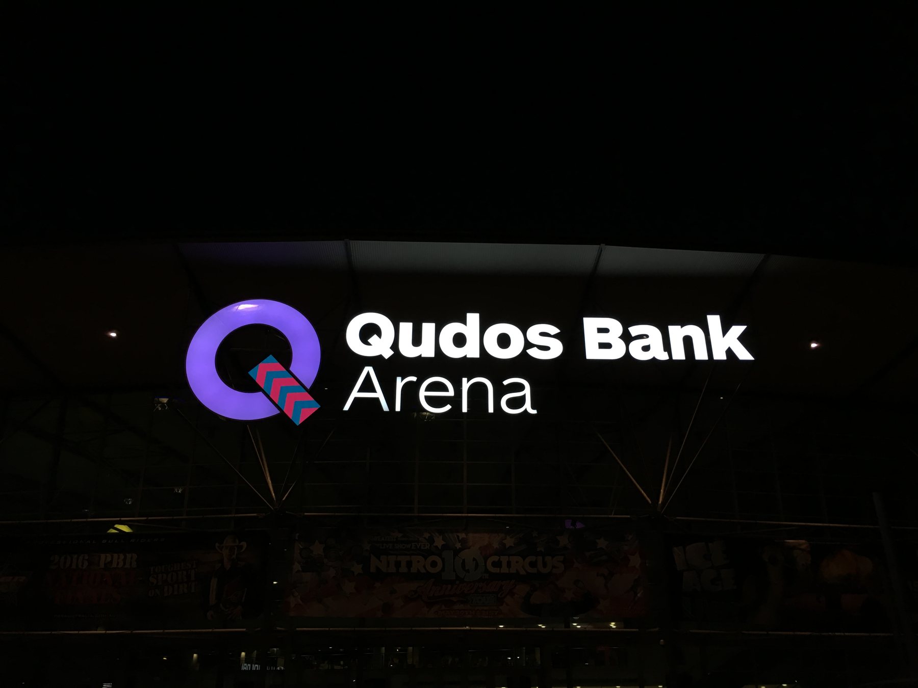 Qudos Bank Arena illuminated logo, purple