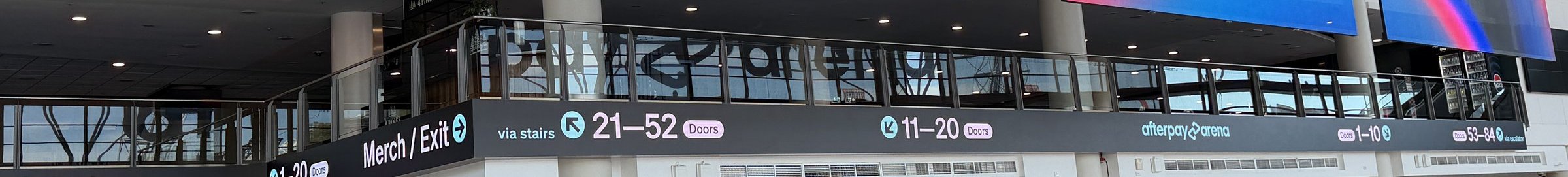 Illuminated ribbon LED wayfinding fascia at Afterpay Arena