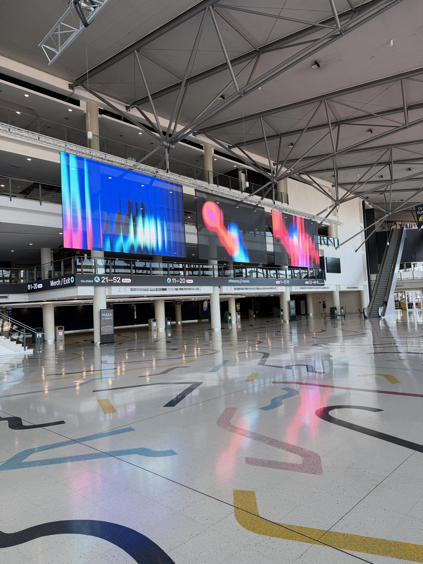 Transparent LED screens at Afterpay Arena, abstract colour content