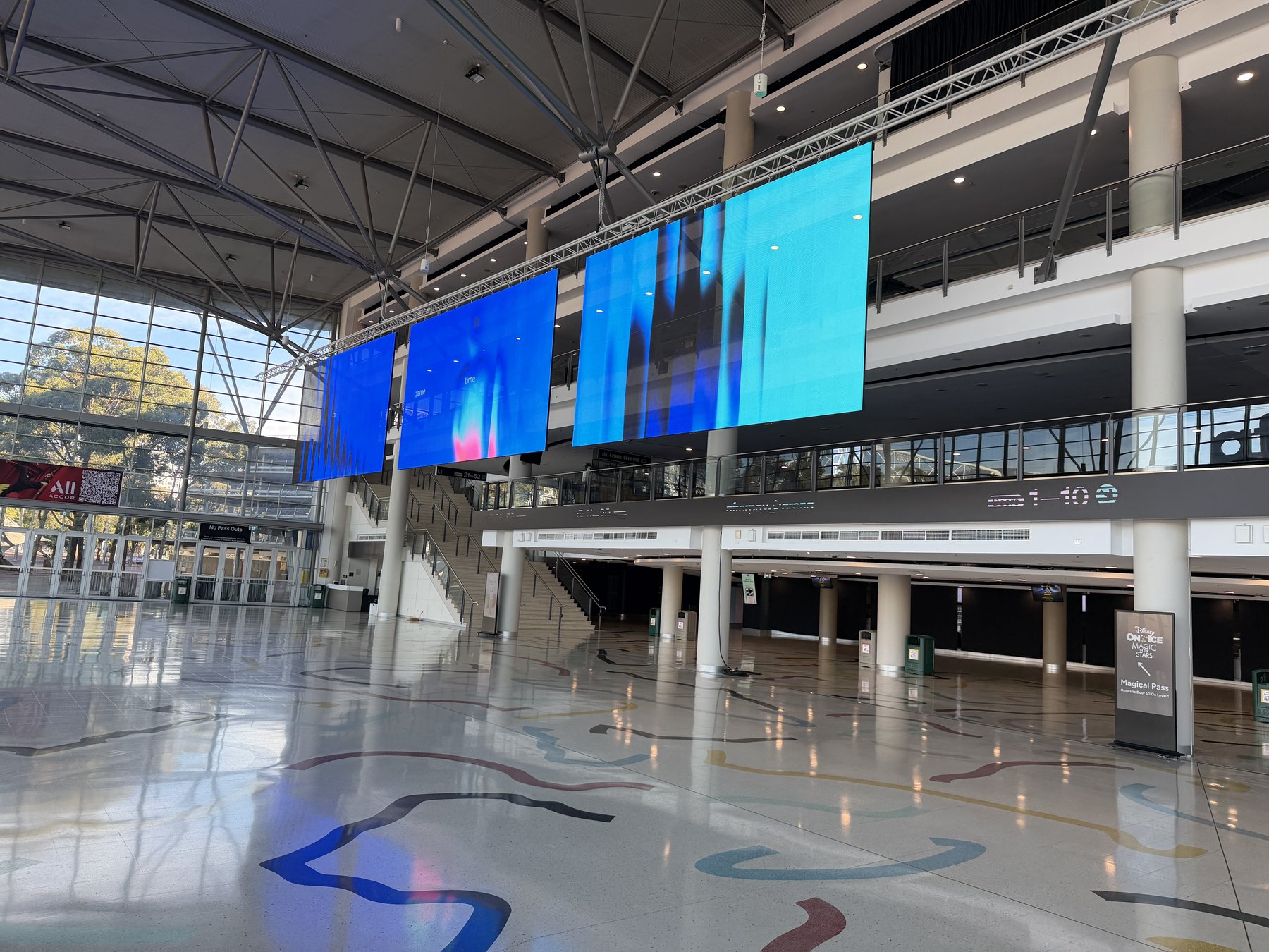 Transparent LED screens at Afterpay Arena, blue content